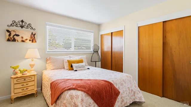 an aerial view of a house with a yard and garden