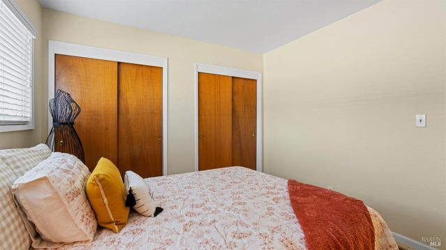 an aerial view of a residential houses with yard