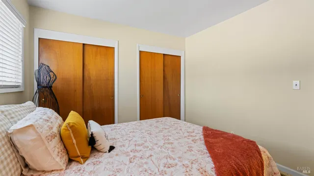 an aerial view of a residential houses with yard