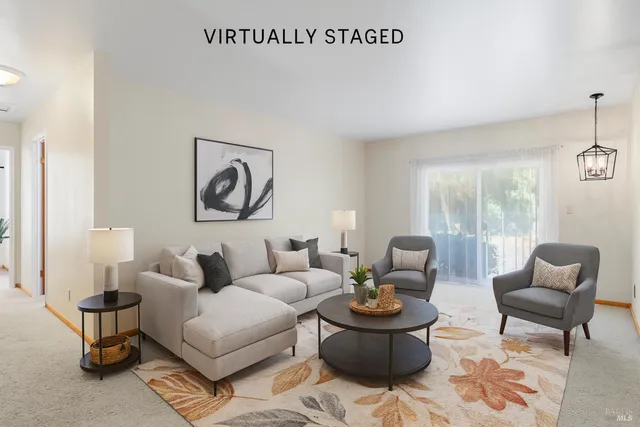 a living room with furniture and a window