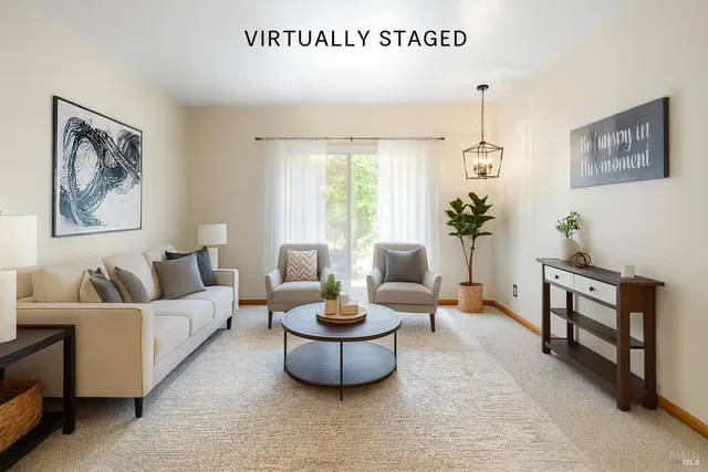 a kitchen with stainless steel appliances granite countertop a refrigerator a stove a sink and dishwasher with a dining table