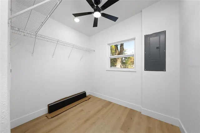 a view of room with window and ceiling fan