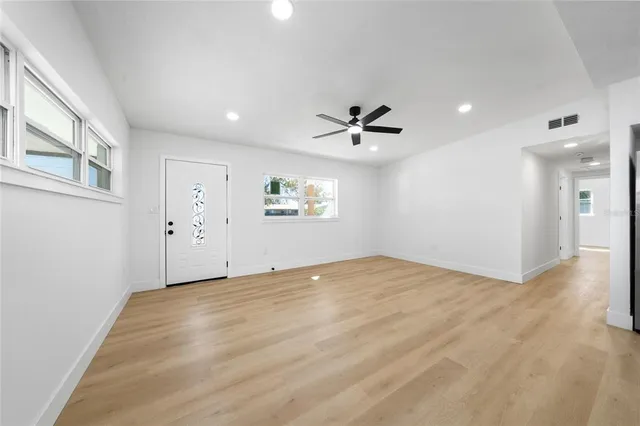 a view of an empty room with a window