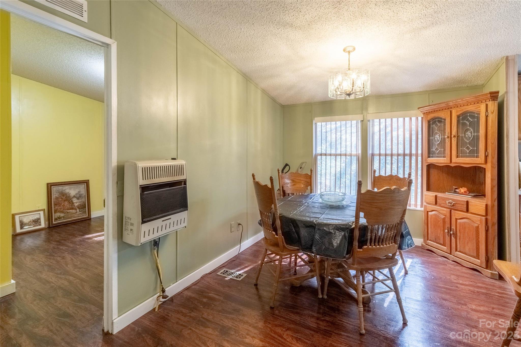 170 Painter Street Sylva, NC 28779 - Photo 12 of 48 a view of a dining room with furniture window and wooden floor