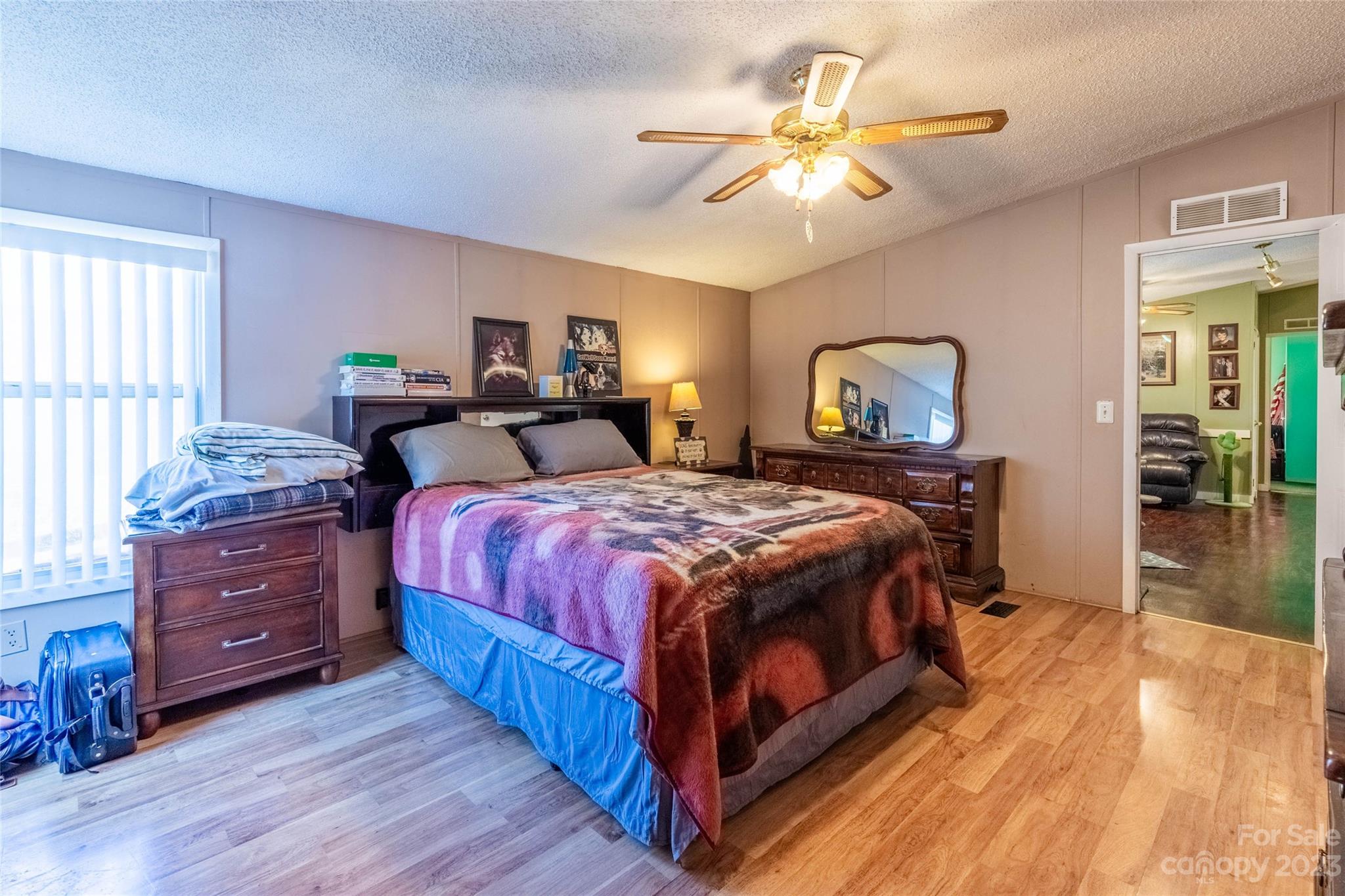 170 Painter Street Sylva, NC 28779 - Photo 13 of 48 a bed room with a bed and a chandelier