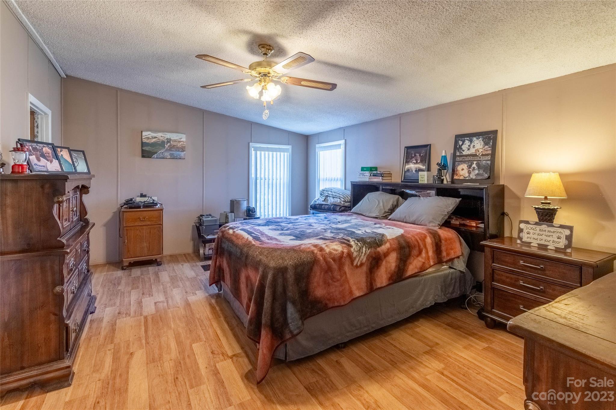 170 Painter Street Sylva, NC 28779 - Photo 14 of 48 a bedroom with a bed and wooden floor