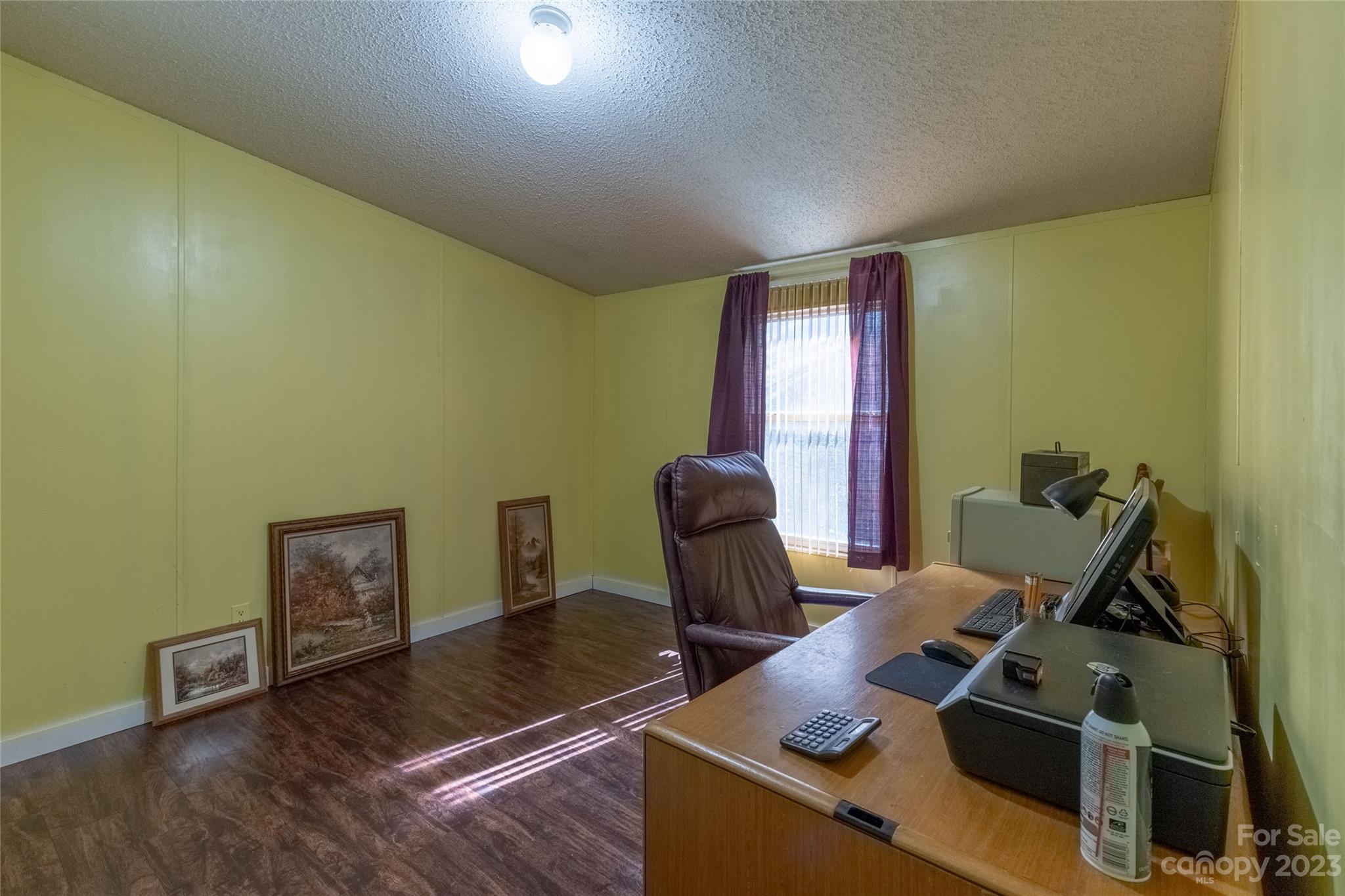 170 Painter Street Sylva, NC 28779 - Photo 18 of 48 a work room with furniture and wooden floor