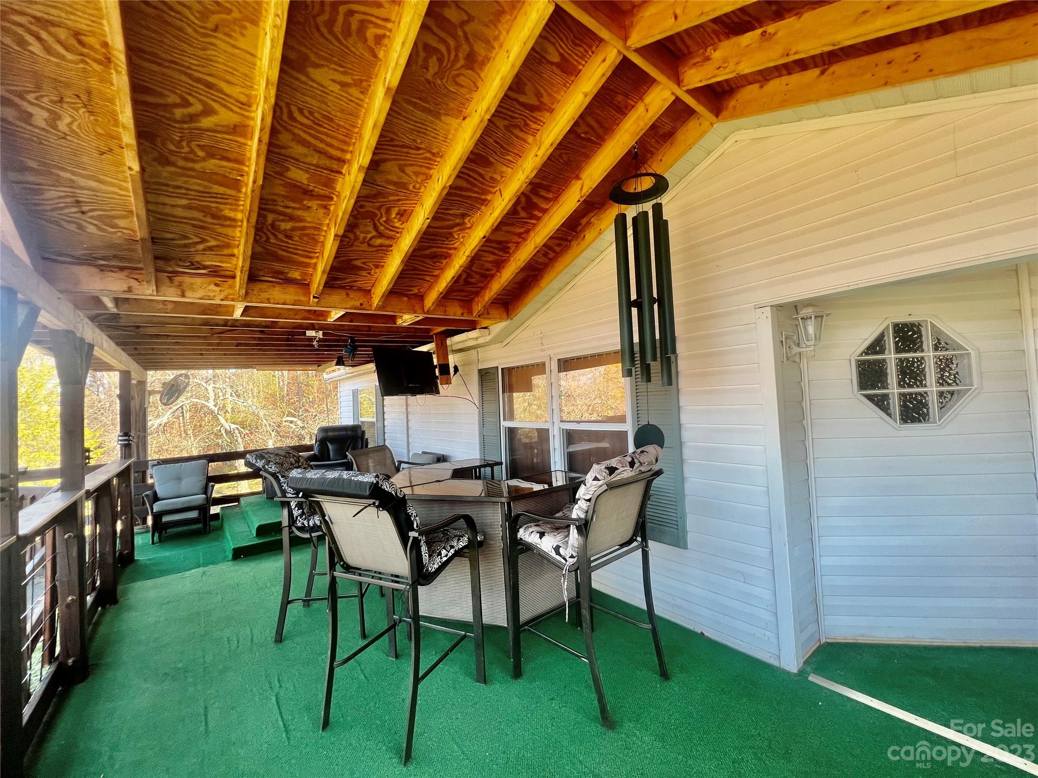 170 Painter Street Sylva, NC 28779 - Photo 22 of 48 a view of a porch with chairs and backyard