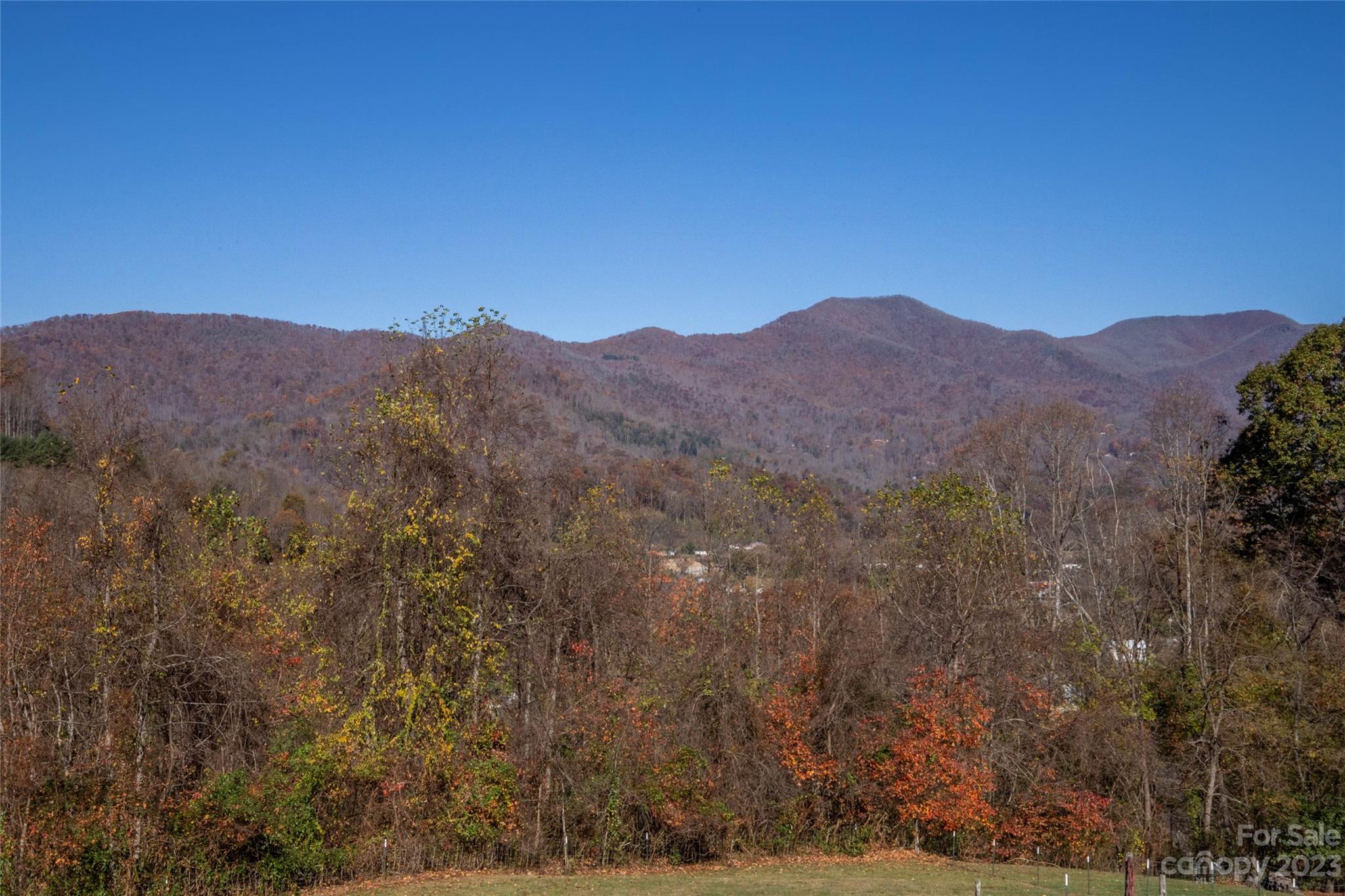 170 Painter Street Sylva, NC 28779 - Photo 24 of 48 a view of a mountain range in a cloudy sky