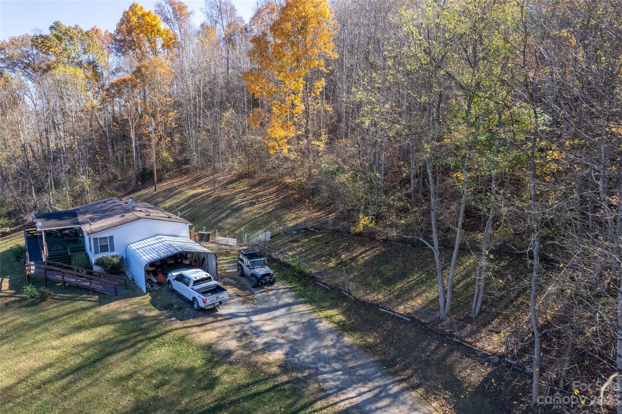 170 Painter Street Sylva, NC 28779 - Photo 35 of 48 a view of a house with a yard