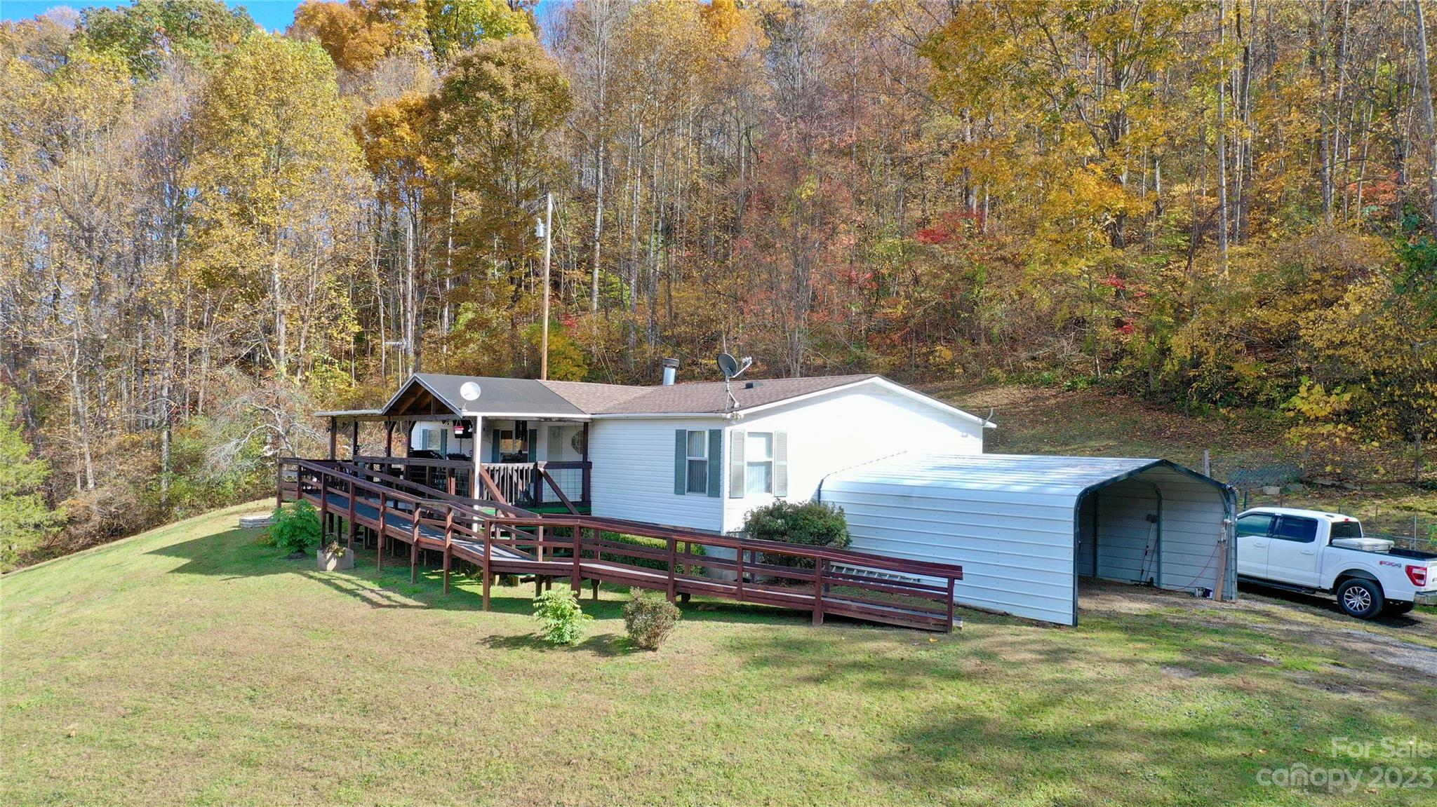 170 Painter Street Sylva, NC 28779 - Photo 39 of 48 front view of a house with a yard and deck