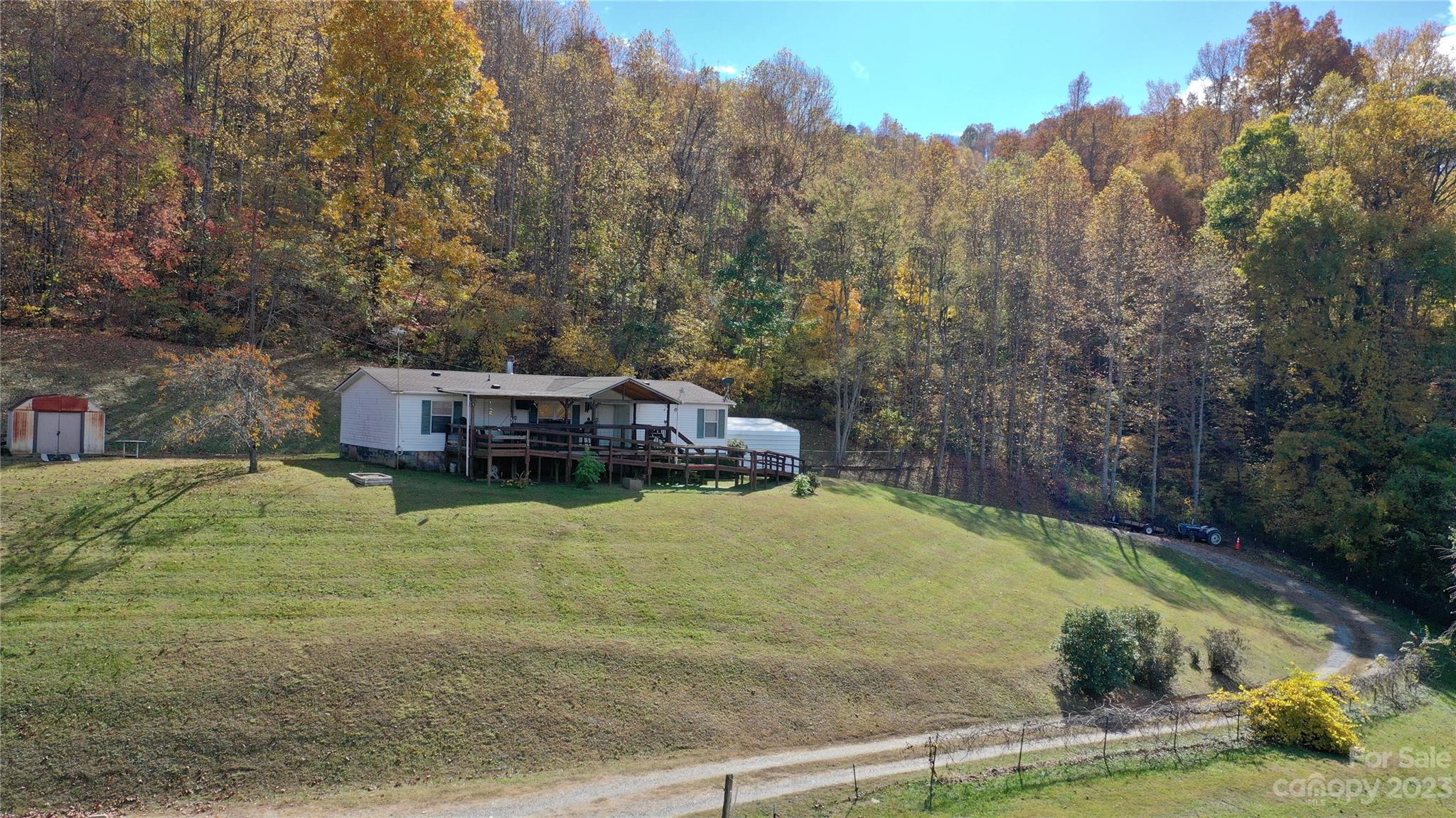170 Painter Street Sylva, NC 28779 - Photo 40 of 48 a balcony with a yard and large trees