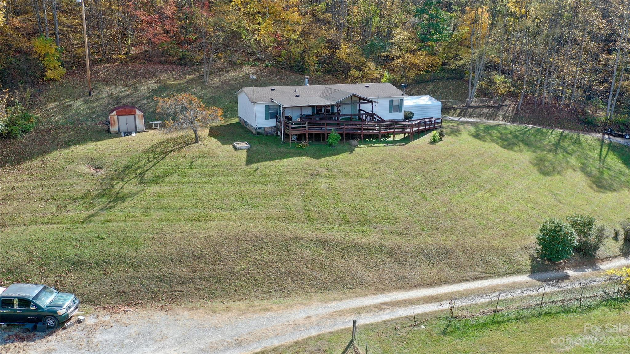 170 Painter Street Sylva, NC 28779 - Photo 46 of 48 a small pool with some trees in the background