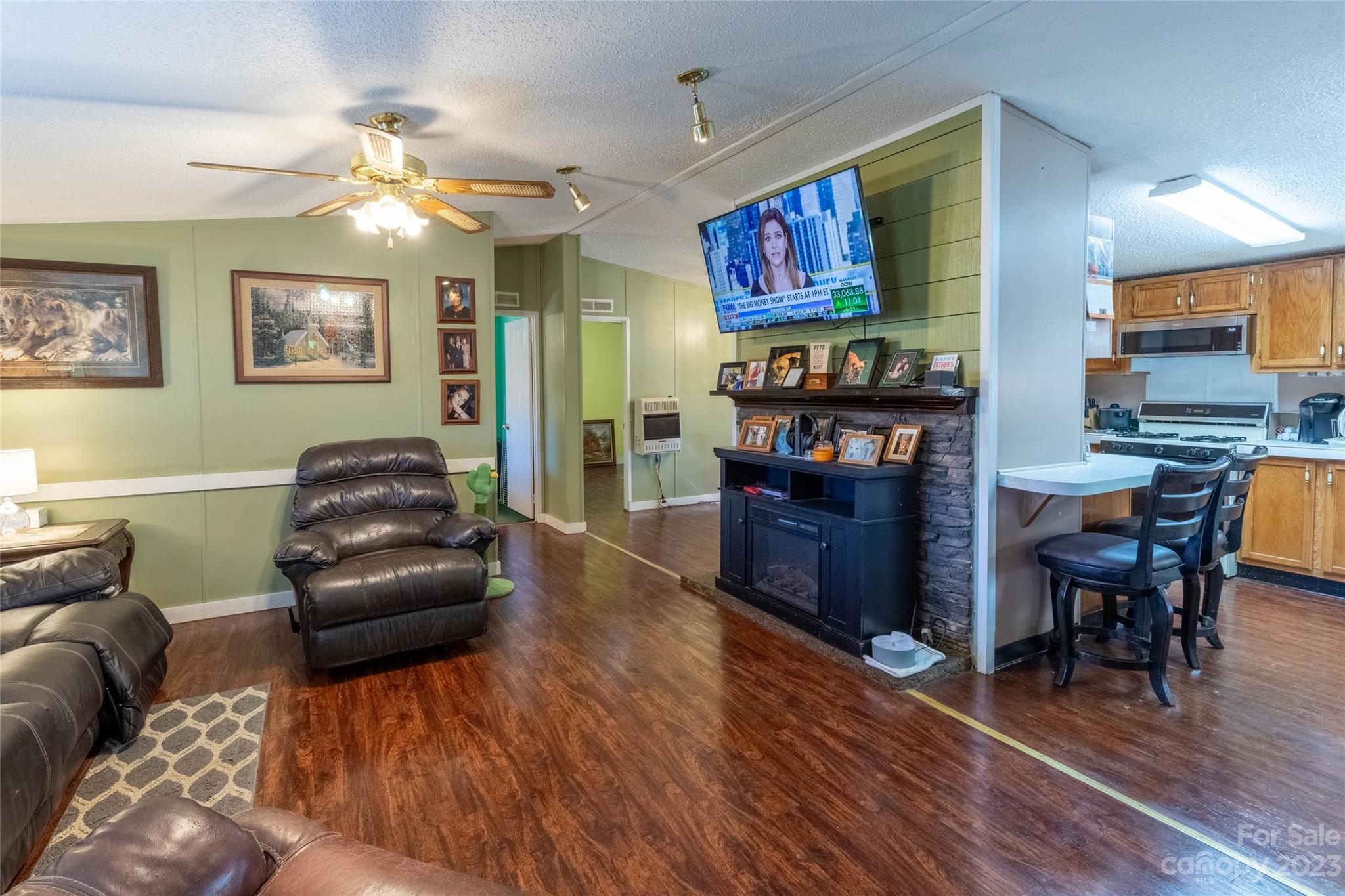 170 Painter Street Sylva, NC 28779 - Photo 6 of 48 a living room with furniture and a wooden floor