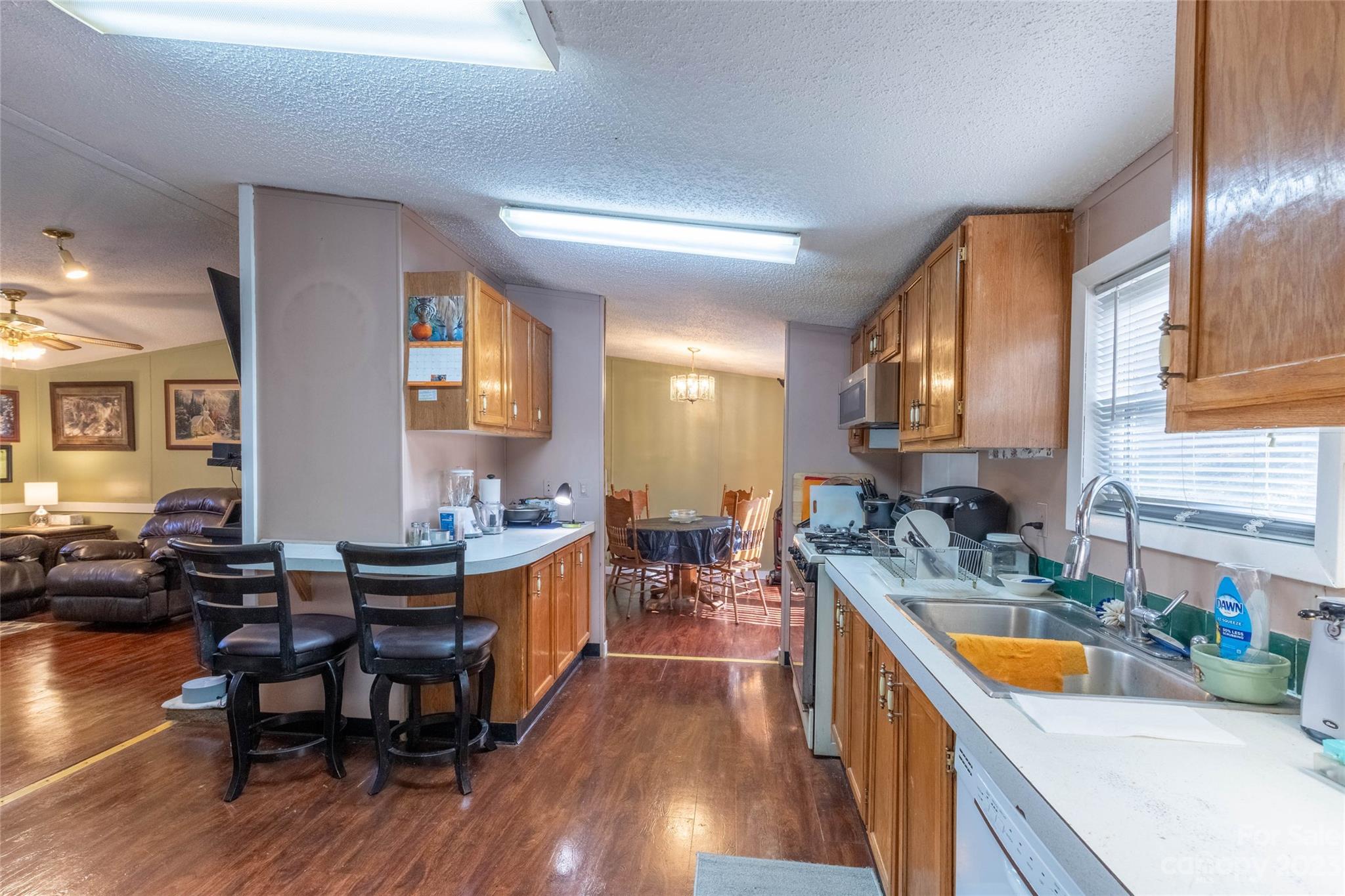 170 Painter Street Sylva, NC 28779 - Photo 10 of 48 a kitchen with a table chairs and wooden floor