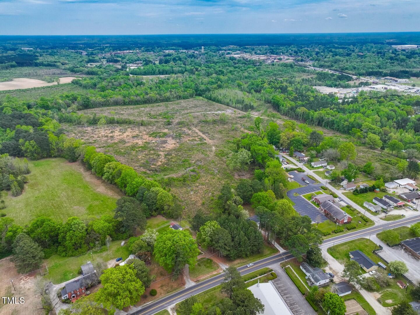0 Wilsons Mills Road Smithfield, NC 27577 - Photo 12 of 15 a view of a lake with a city