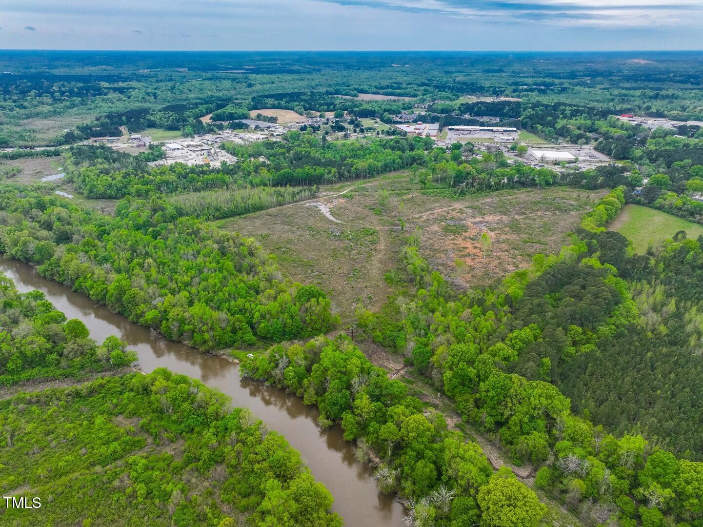 0 Wilsons Mills Road Smithfield, NC 27577 - Photo 10 of 15 a view of a lake with a city