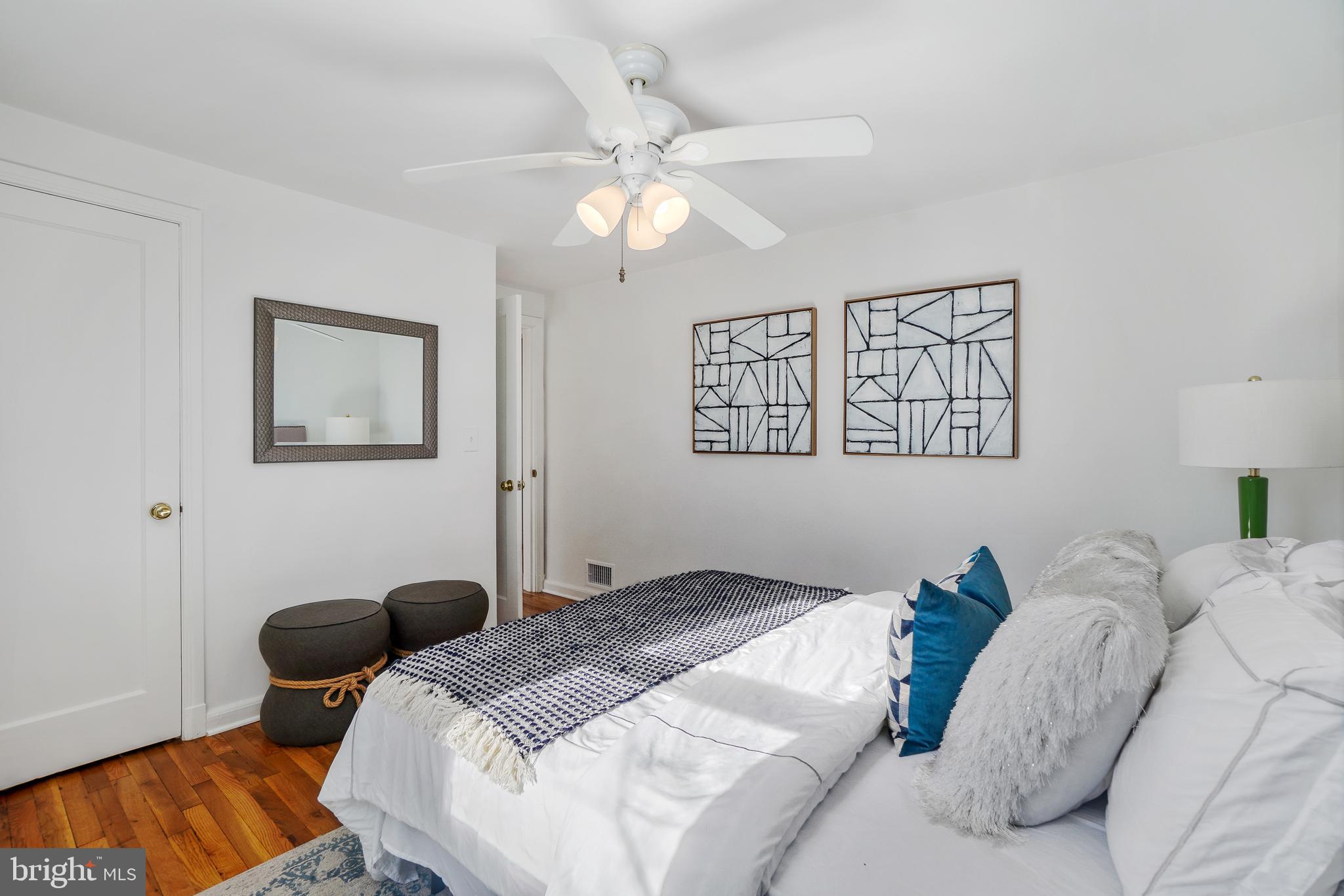 2707 Harmon Road Silver Spring, MD 20902 - Photo 13 of 22 a bedroom with bed and a chandelier