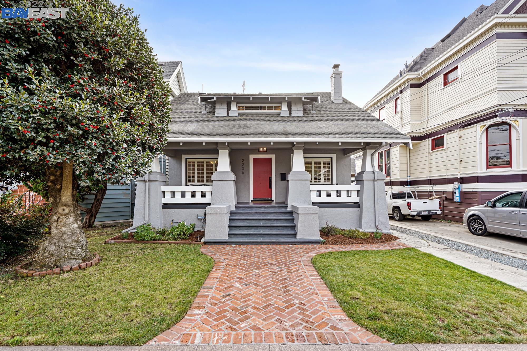 2206 Clinton Avenue Alameda, CA 94501 - Photo 1 of 1 a front view of a house with garden
