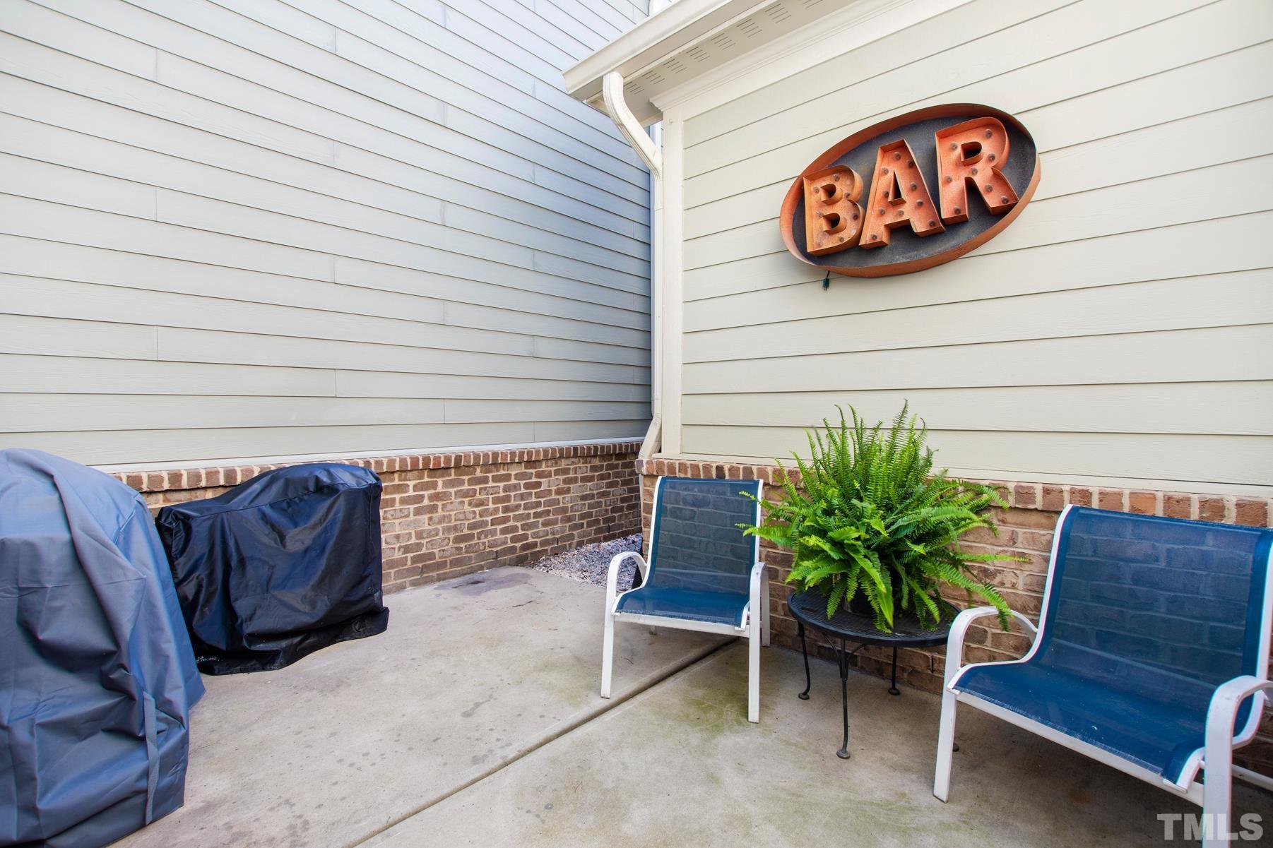 2307 Lowden Street Raleigh, NC 27608 - Photo 6 of 10 a wooden bench sitting in backside of a building