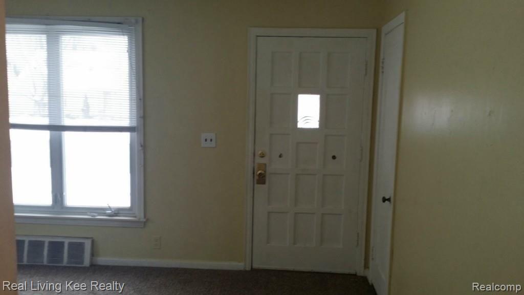 3512 Normandy Road Royal Oak, MI 48073 - Photo 3 of 18 The inviting living room has new carpet and lots of light!
