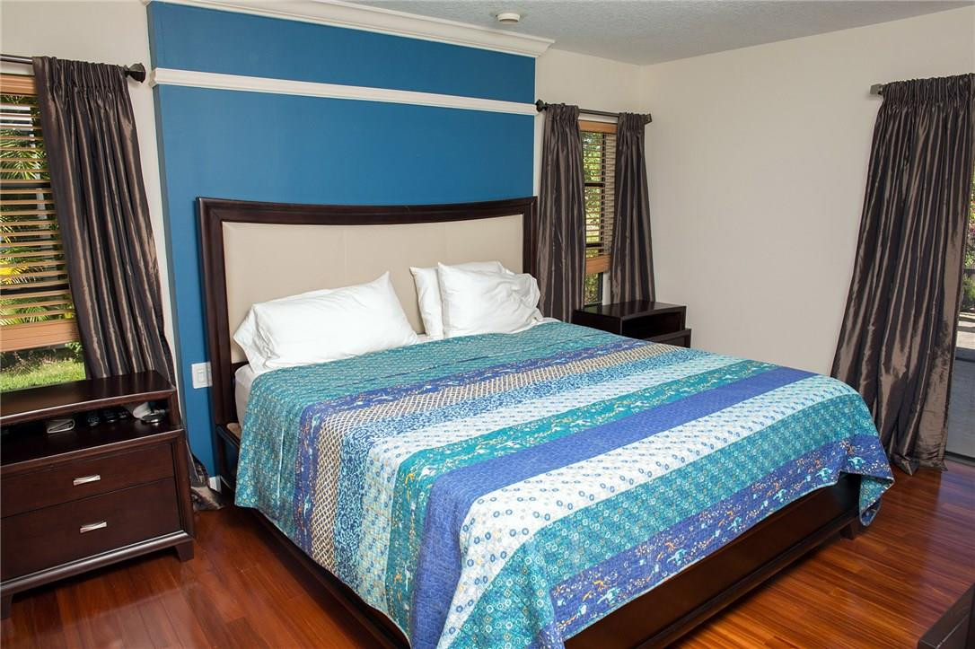 10049 Crosswind Road Boca Raton, FL 33498 - Photo 8 of 12 Large master bedroom with wood floors.