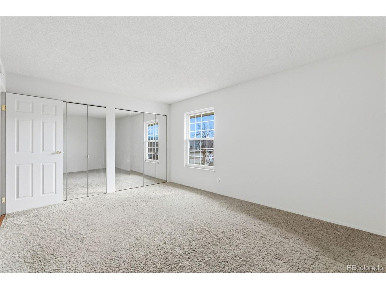 10251 West 44th Avenue, Unit 208 Wheat Ridge, CO 80033 - Photo 15 of 28 a view of an empty room with a window