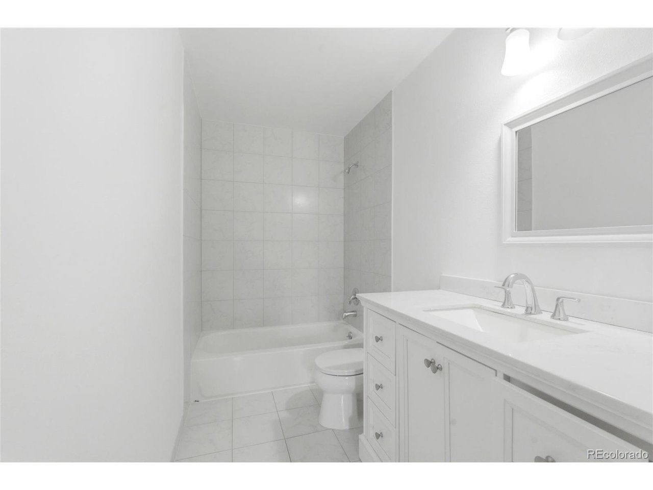 10251 West 44th Avenue, Unit 208 Wheat Ridge, CO 80033 - Photo 16 of 28 a bathroom with a sink and a mirror