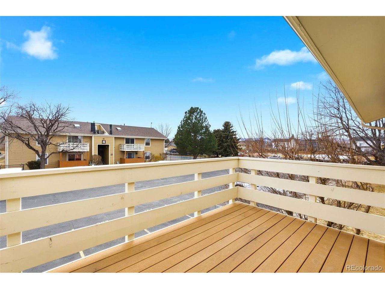10251 West 44th Avenue, Unit 208 Wheat Ridge, CO 80033 - Photo 19 of 28 a view of entryway and hall with wooden floor