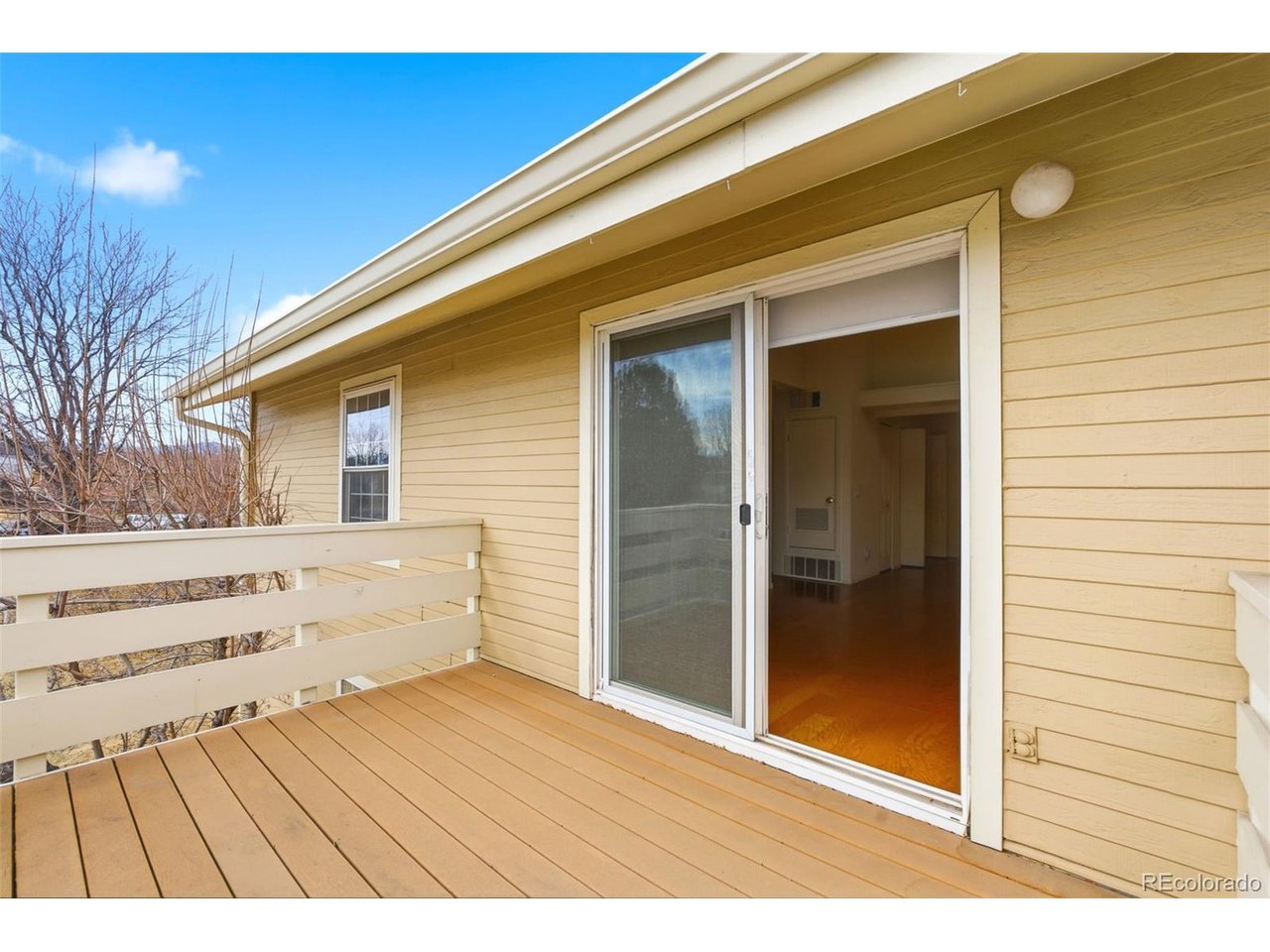 10251 West 44th Avenue, Unit 208 Wheat Ridge, CO 80033 - Photo 20 of 28 a view of backyard with wooden floor
