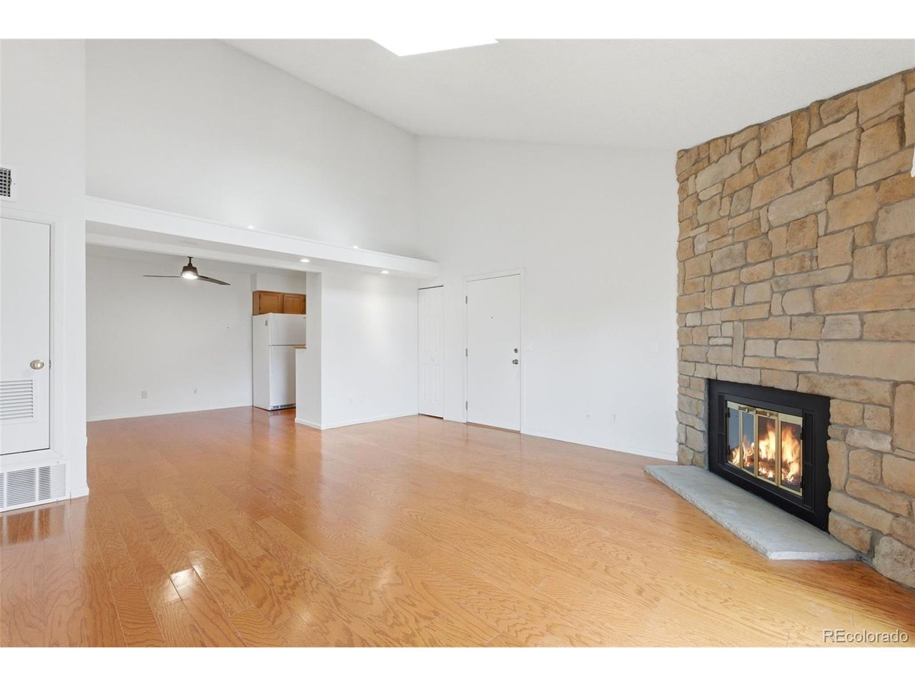 10251 West 44th Avenue, Unit 208 Wheat Ridge, CO 80033 - Photo 5 of 28 a view of empty room with a fireplace