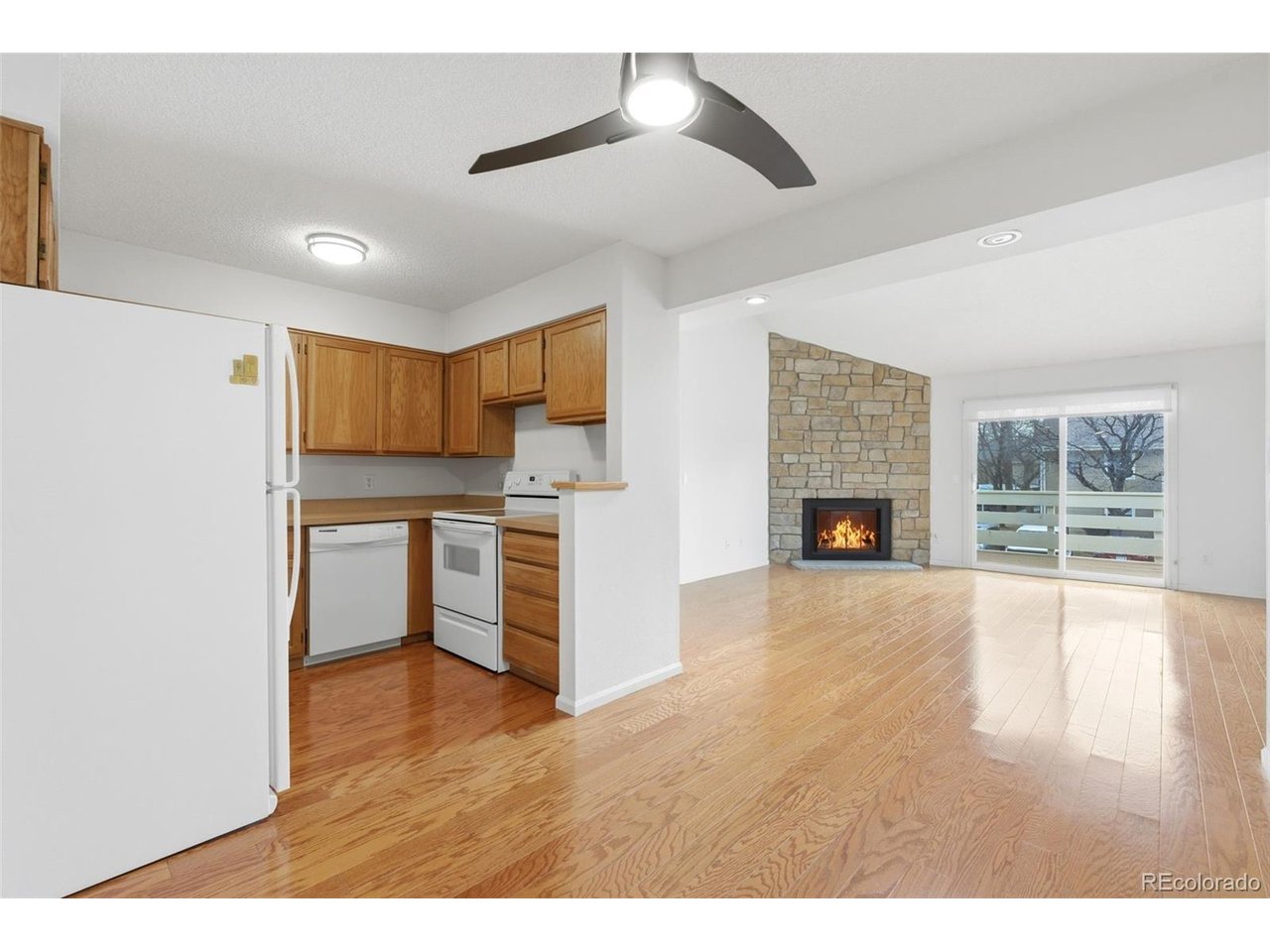 10251 West 44th Avenue, Unit 208 Wheat Ridge, CO 80033 - Photo 9 of 28 a view of empty room with wooden floor and window