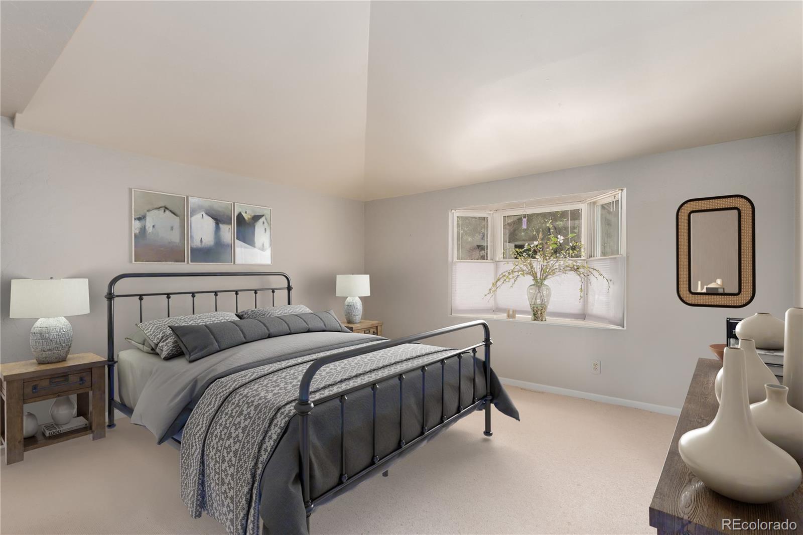 200 East Caley Avenue Centennial, CO 80121 - Photo 15 of 49 a bedroom with a bed a mirror and night stand with a window