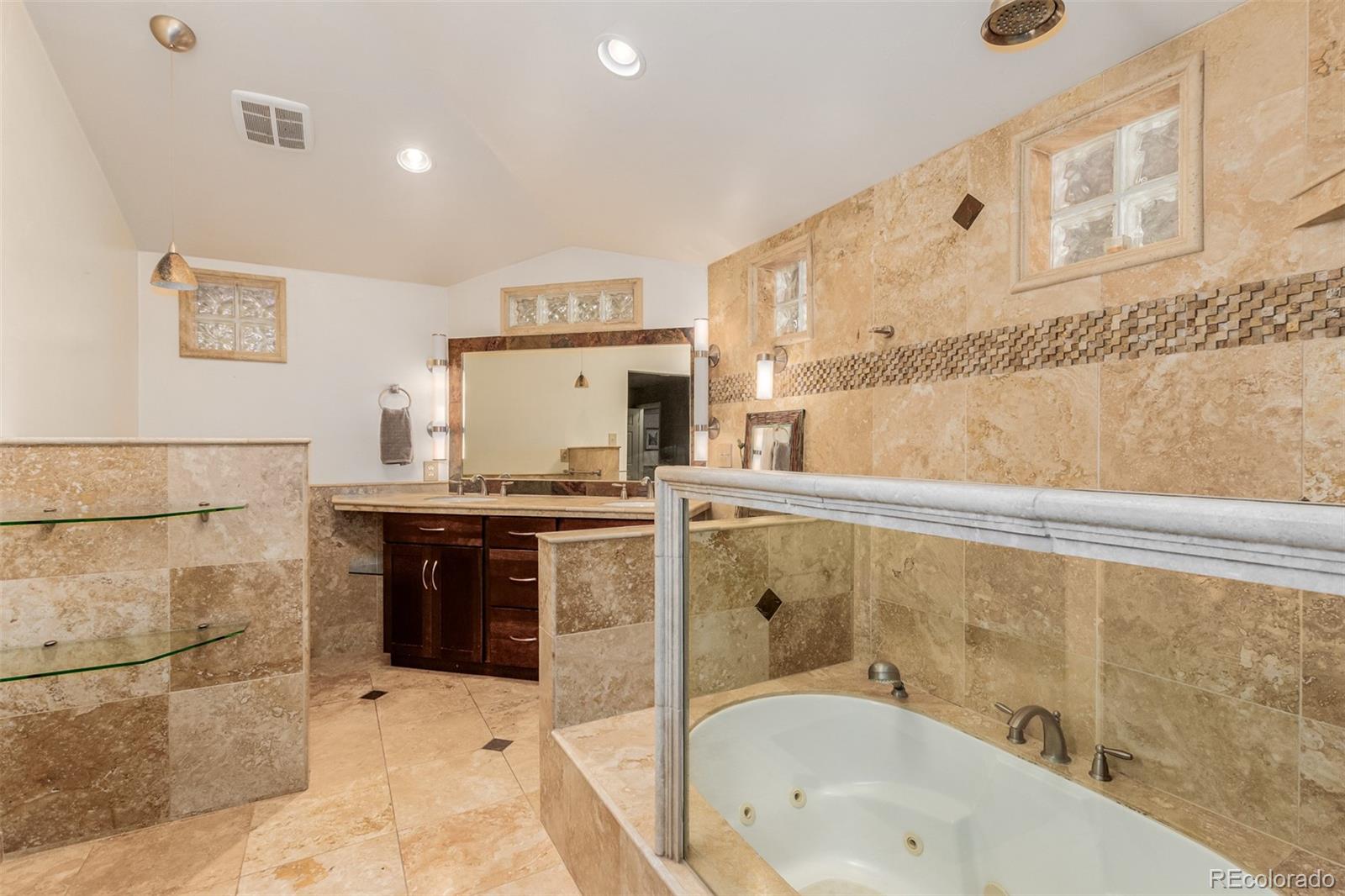200 East Caley Avenue Centennial, CO 80121 - Photo 18 of 49 a bathroom with a granite countertop bathtub sink vanity and toilet