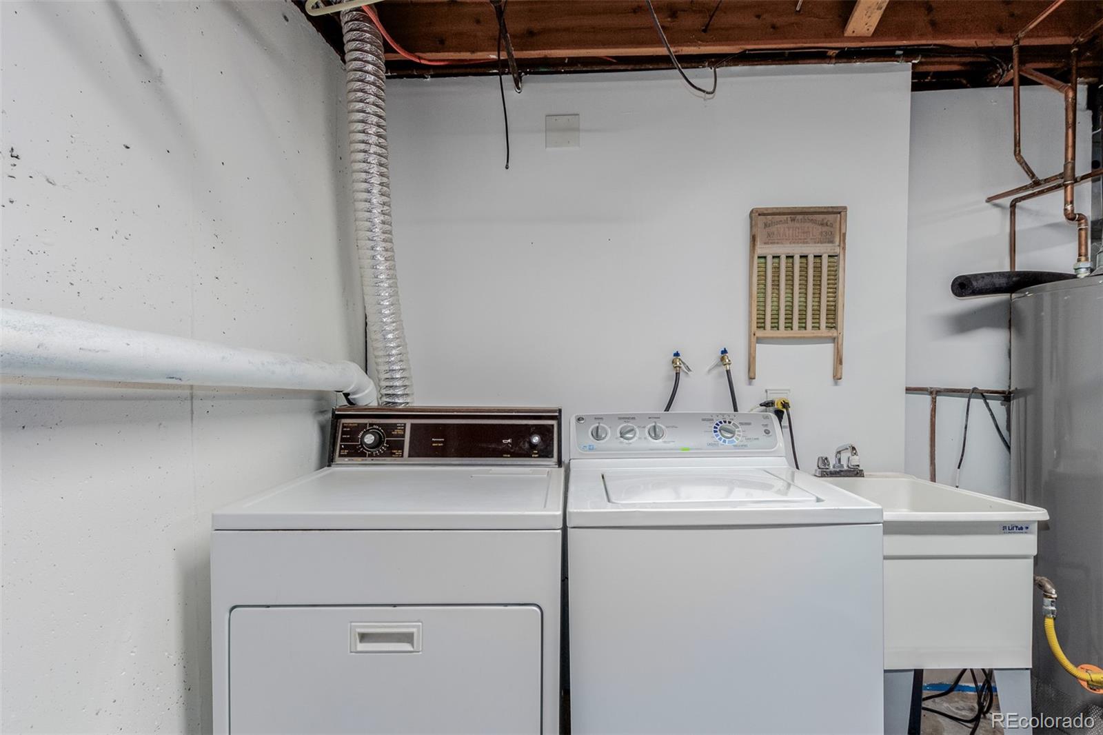 200 East Caley Avenue Centennial, CO 80121 - Photo 32 of 49 a utility room with dryer and washer