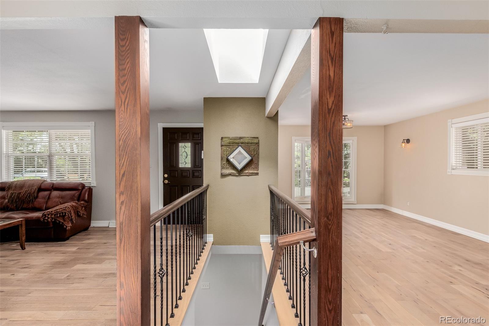 200 East Caley Avenue Centennial, CO 80121 - Photo 4 of 49 a view of a livingroom with furniture and stairs