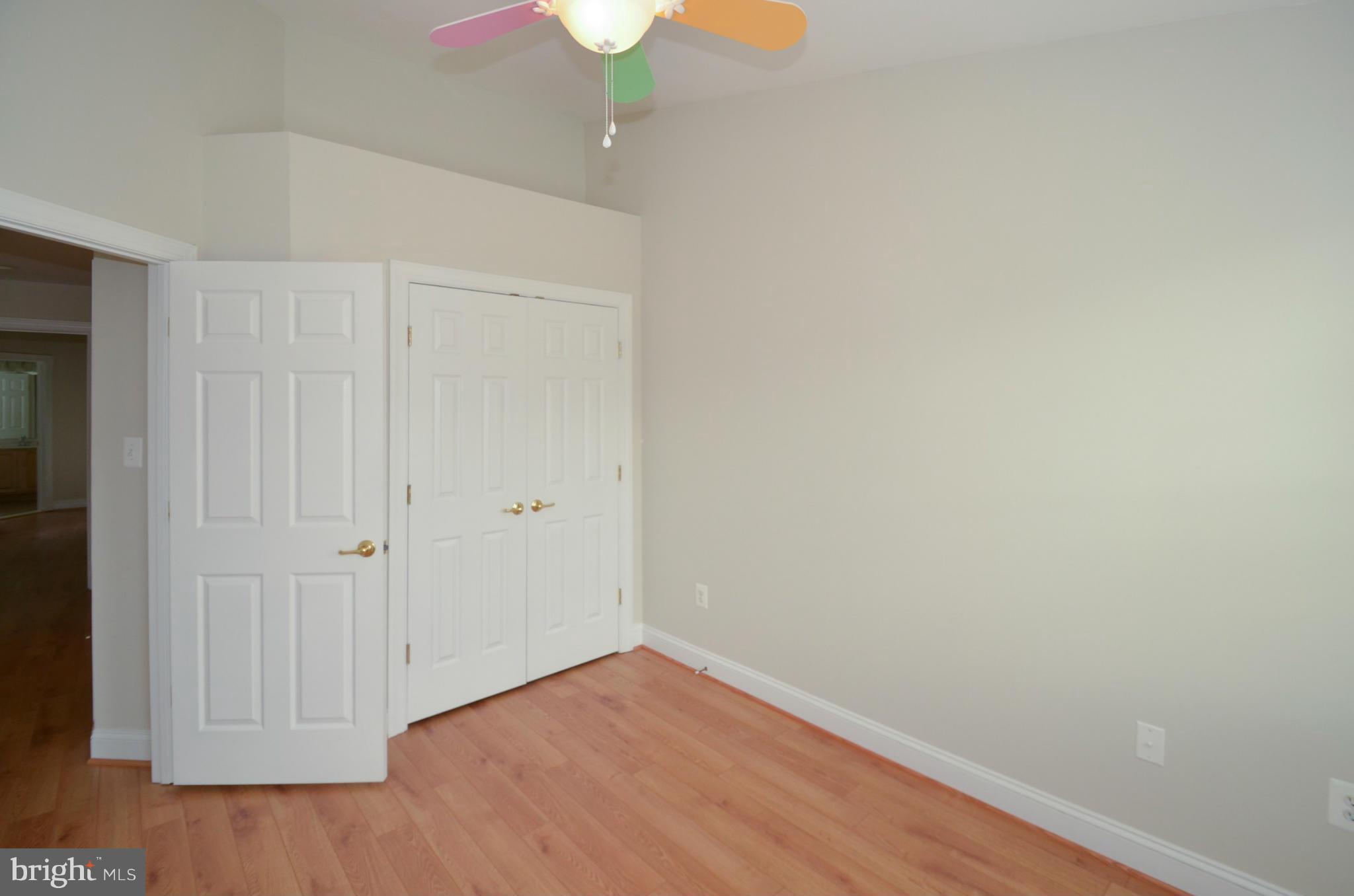 8306 Merlot Lane, Unit 137 Laurel, MD 20723 - Photo 17 of 30 a view of an empty room with wooden floor