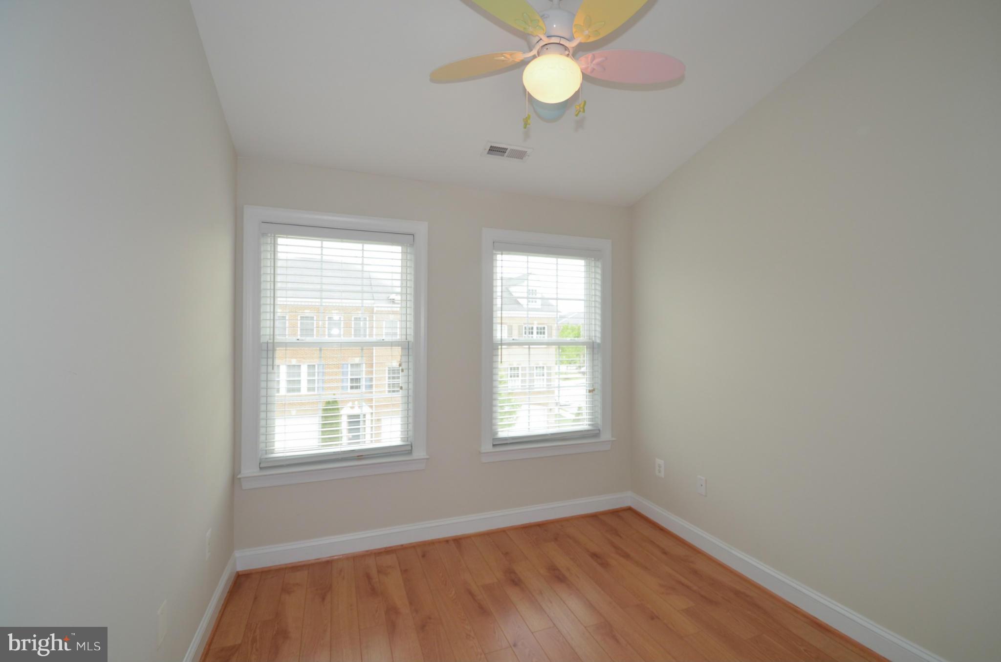 8306 Merlot Lane, Unit 137 Laurel, MD 20723 - Photo 22 of 30 an empty room with a window and a fan