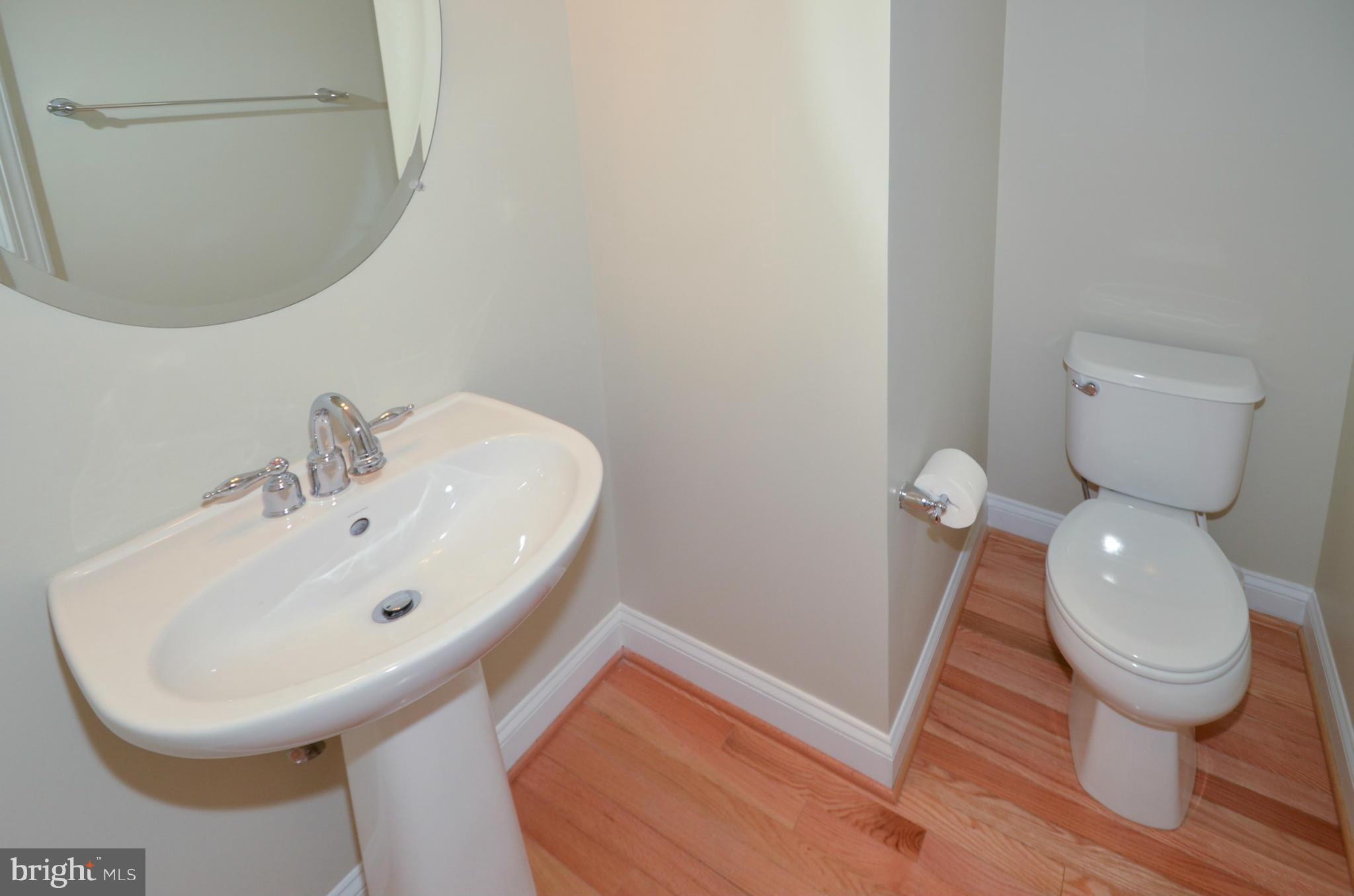 8306 Merlot Lane, Unit 137 Laurel, MD 20723 - Photo 24 of 30 a bathroom with a sink and a toilet