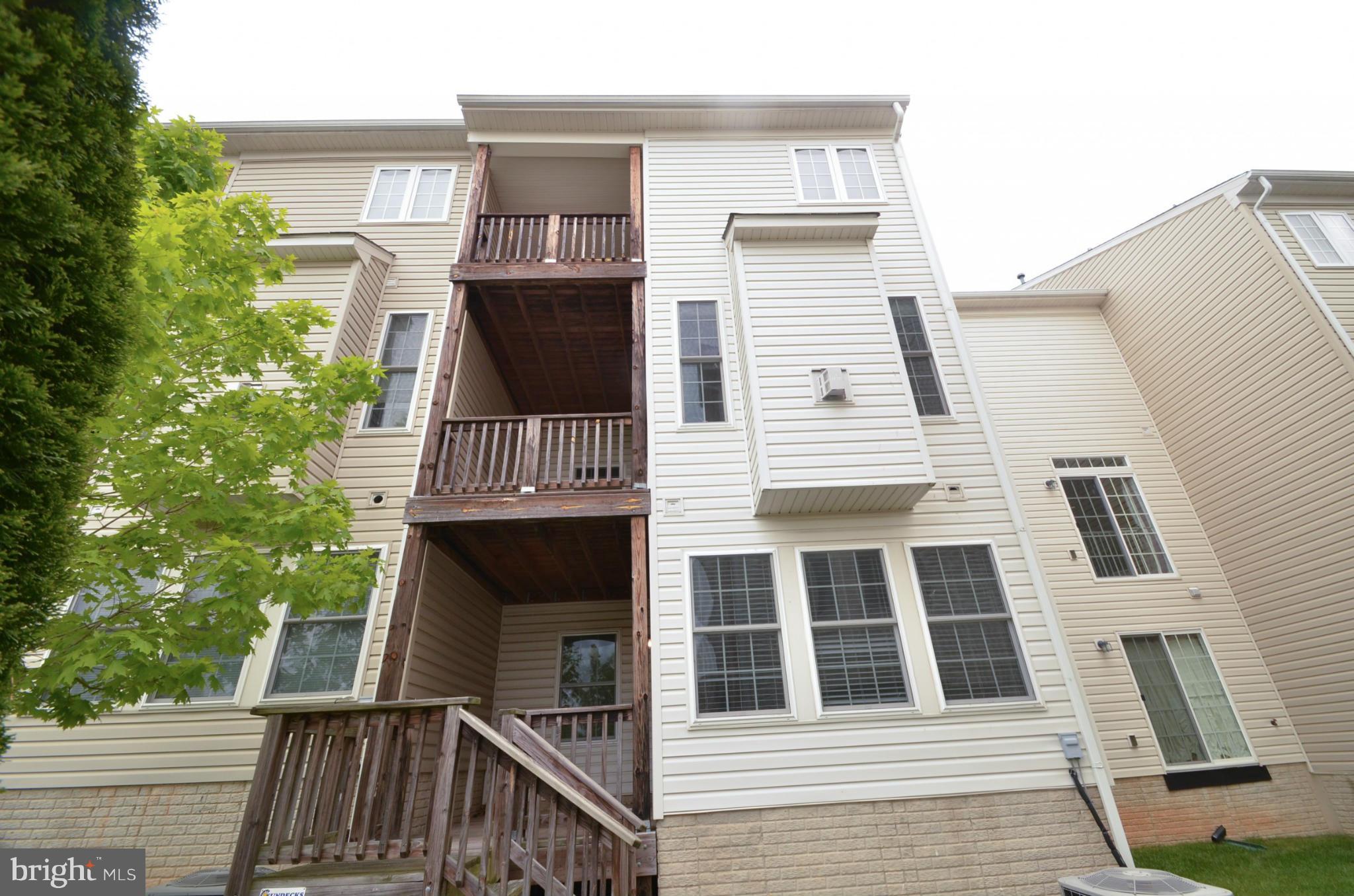 8306 Merlot Lane, Unit 137 Laurel, MD 20723 - Photo 28 of 30 a front view of a house with a door