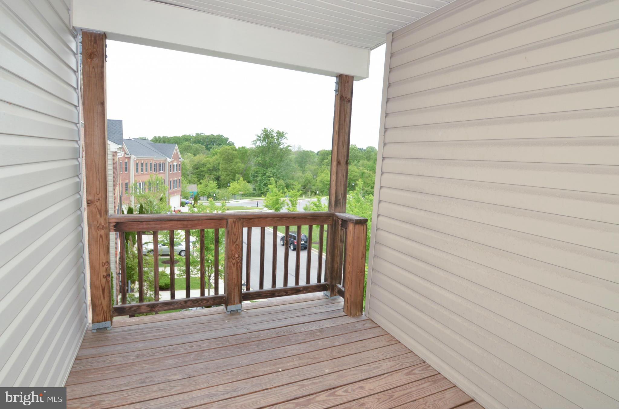 8306 Merlot Lane, Unit 137 Laurel, MD 20723 - Photo 30 of 30 a view of balcony with wooden floor
