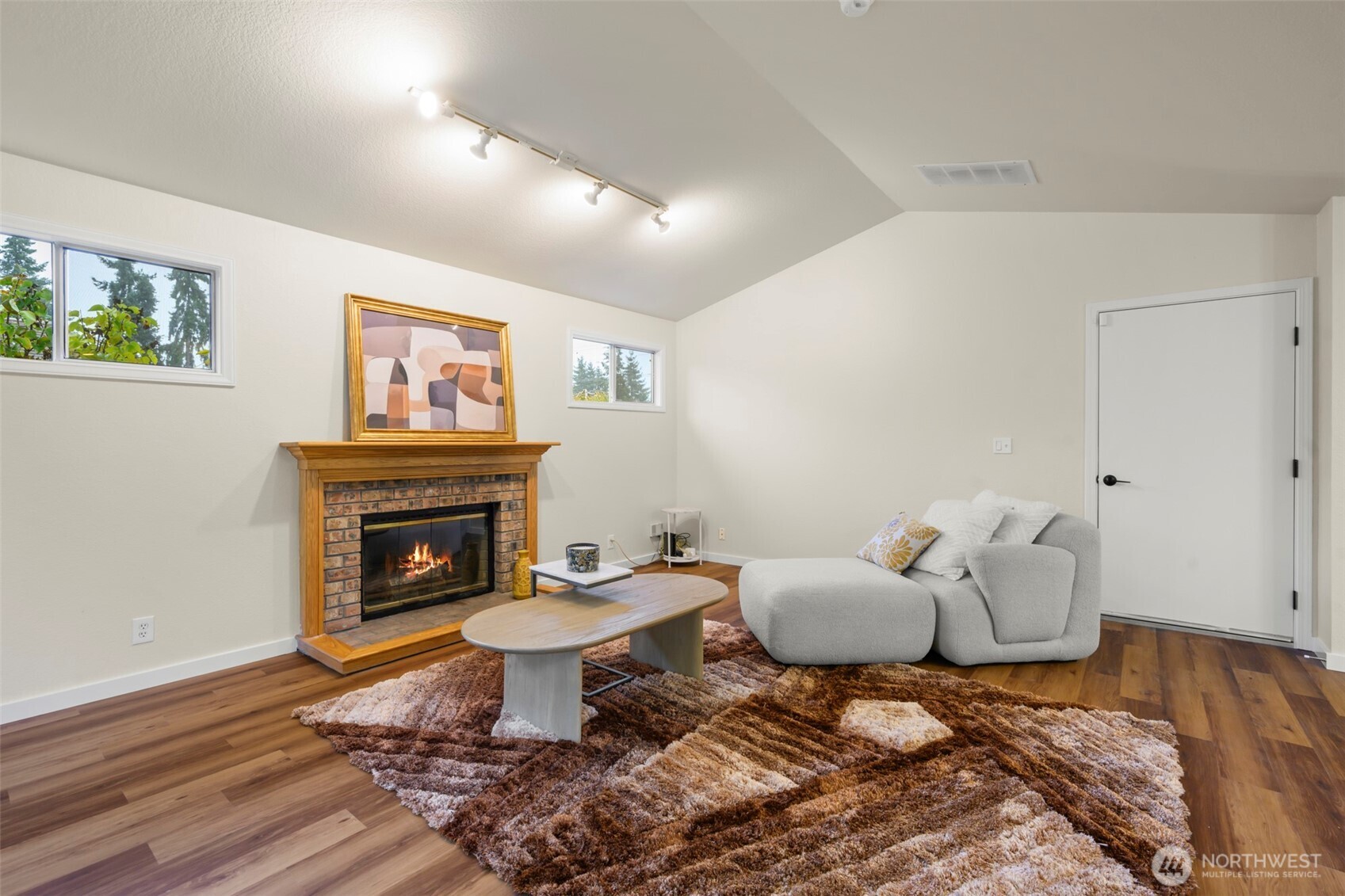 5615 114th Street Southwest Mukilteo, WA 98275 - Photo 12 of 38 a living room with furniture and a fireplace