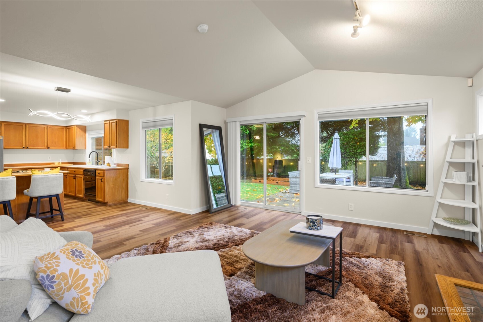 5615 114th Street Southwest Mukilteo, WA 98275 - Photo 13 of 38 a living room with furniture and large windows