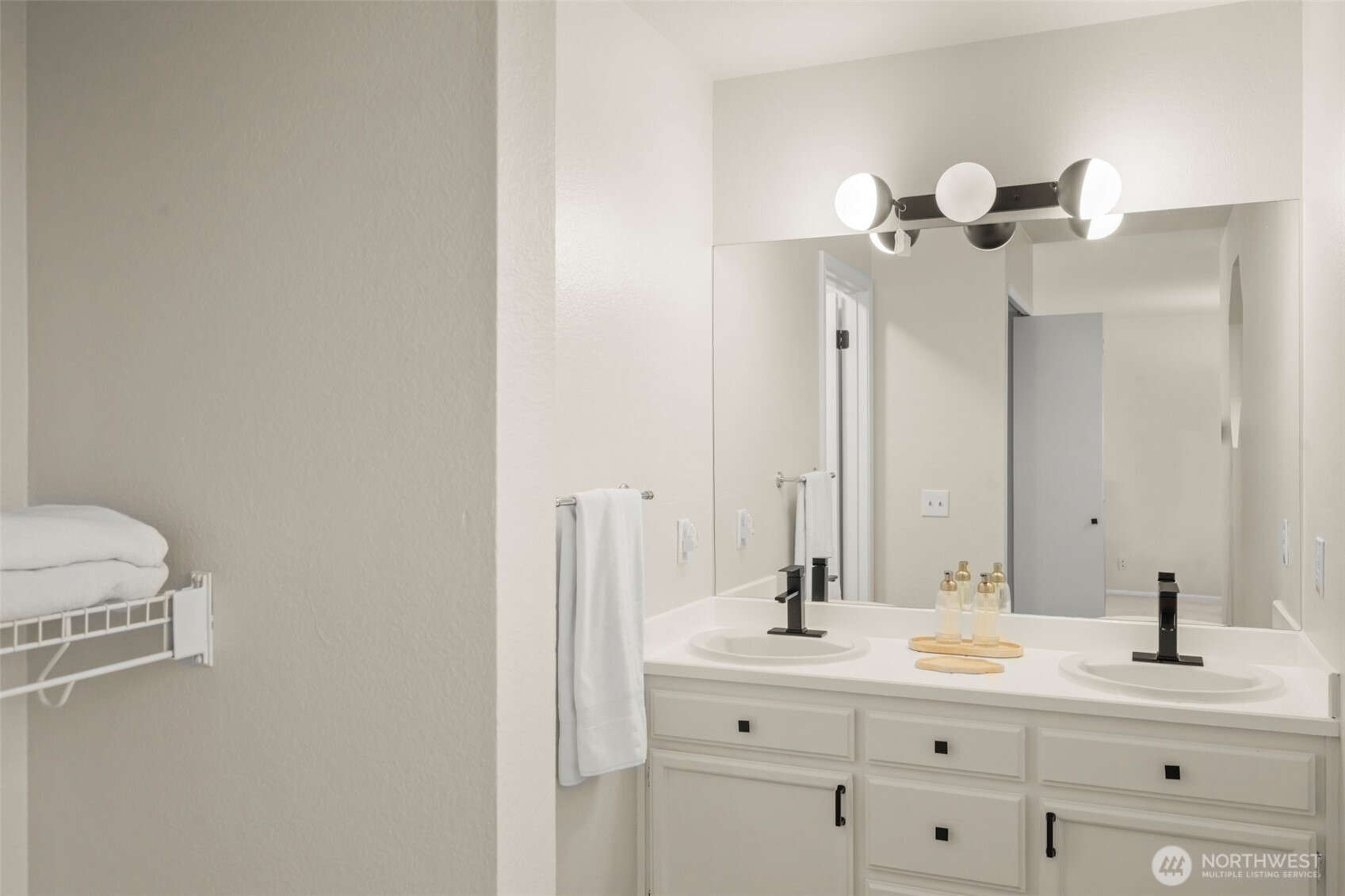 5615 114th Street Southwest Mukilteo, WA 98275 - Photo 20 of 38 a bathroom with a double vanity sink and a mirror