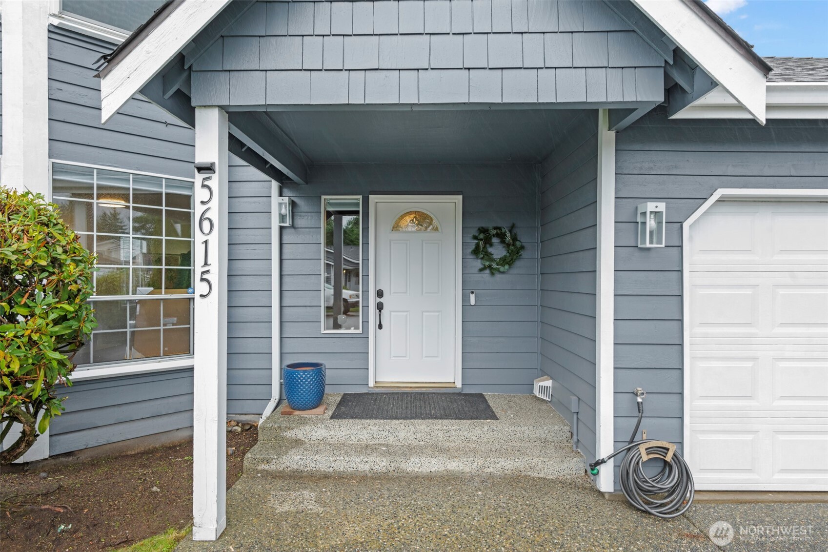 5615 114th Street Southwest Mukilteo, WA 98275 - Photo 2 of 38 a front view of a house with a garage