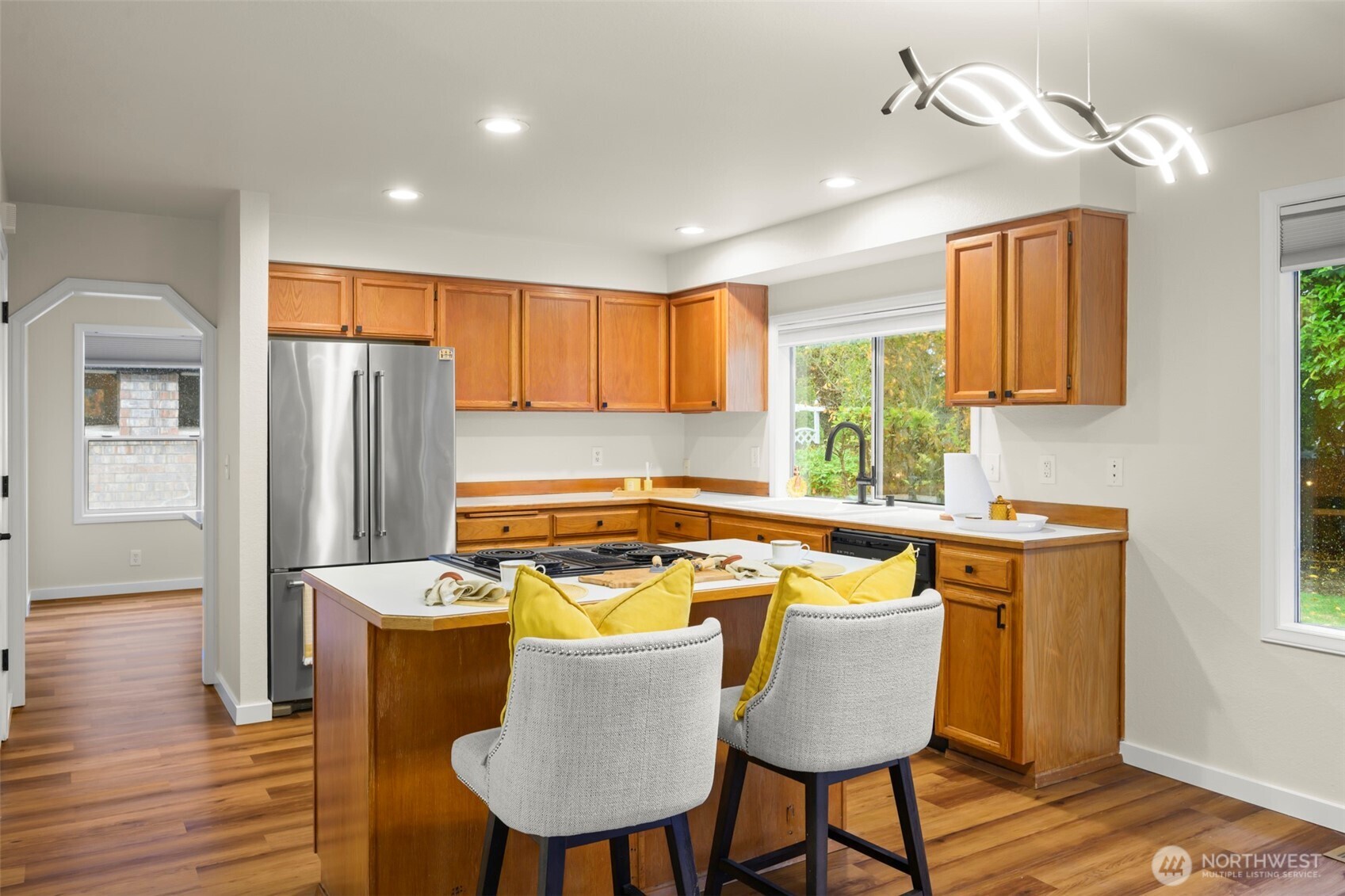 5615 114th Street Southwest Mukilteo, WA 98275 - Photo 5 of 38 a kitchen with a table chairs and refrigerator