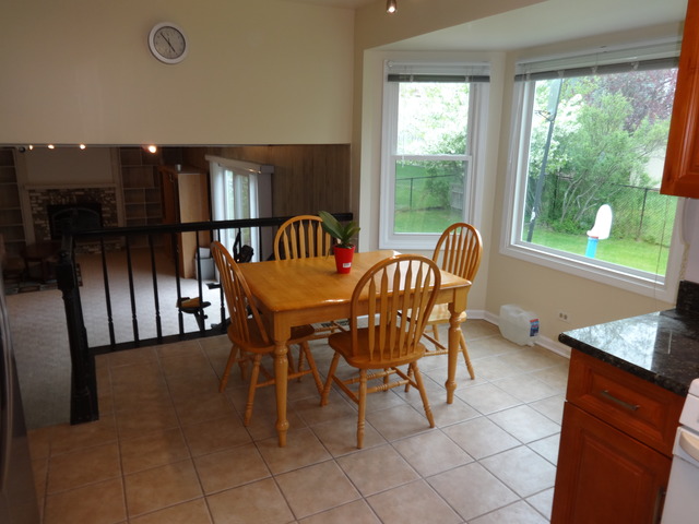 1342 Devonshire Road Buffalo Grove, IL 60089 - Photo 8 of 16 a dining room with furniture and a window