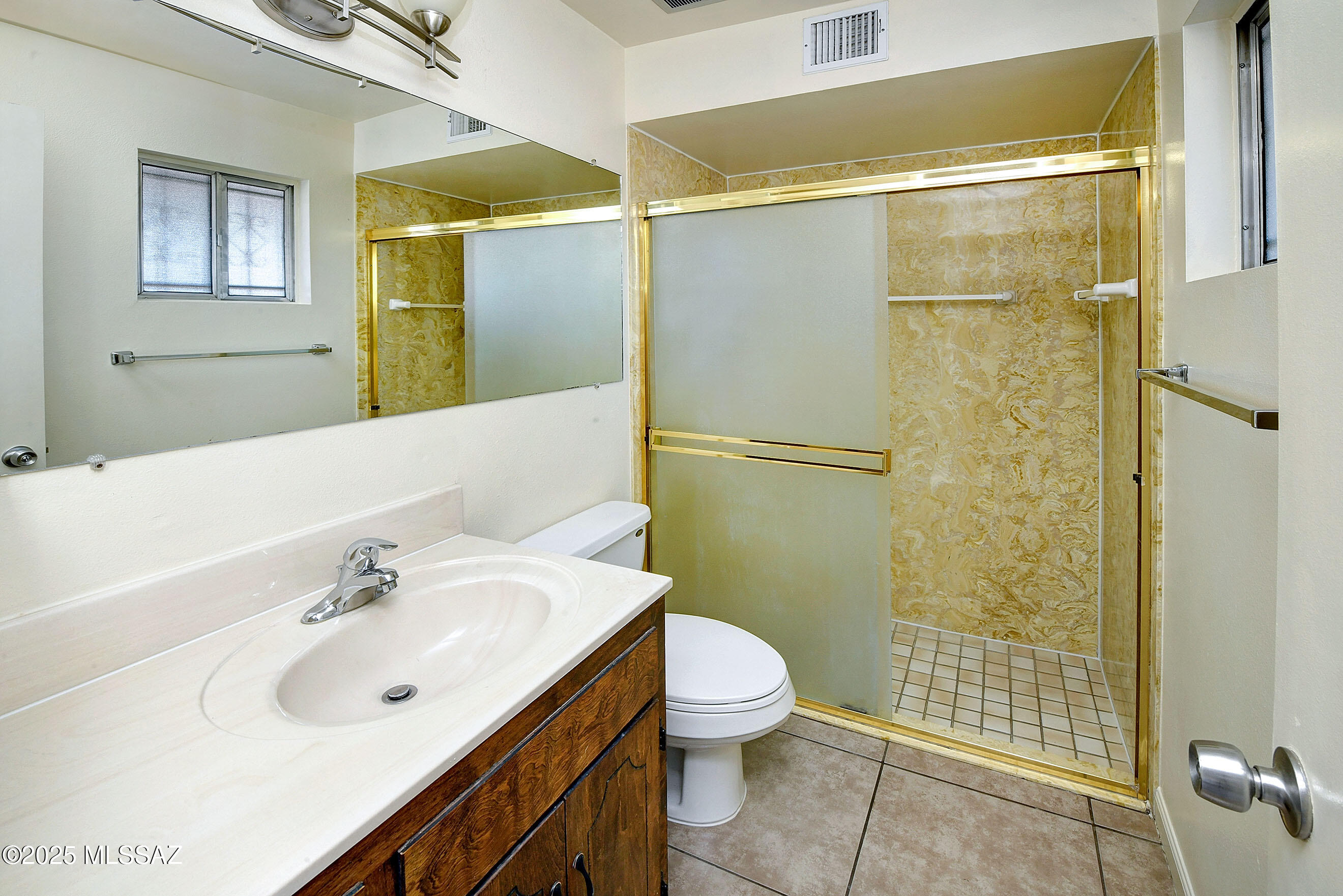 35 East Pastime Road Tucson, AZ 85705 - Photo 11 of 28 a bathroom with a sink and a mirror