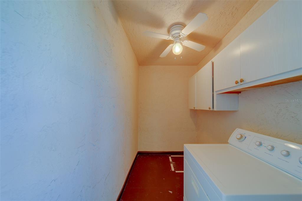 1 Windrush Boulevard, Unit 28 Indian Rocks Beach, FL 33785 - Photo 14 of 68 a utility room with dryer and washer
