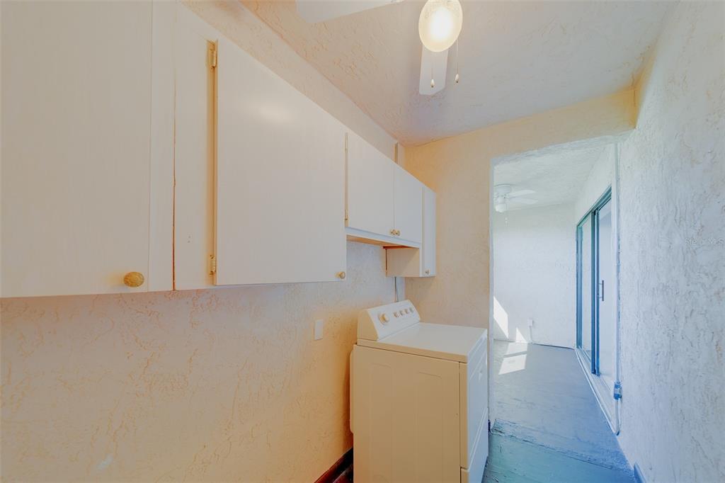 1 Windrush Boulevard, Unit 28 Indian Rocks Beach, FL 33785 - Photo 15 of 68 a view of kitchen and utility room